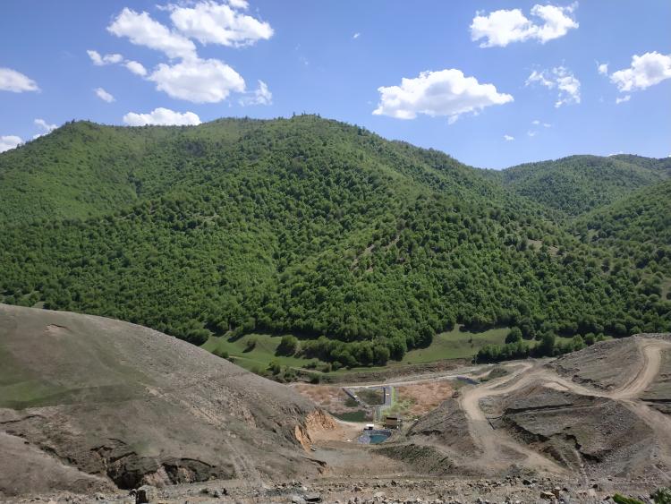 Hill, forest and artificial water reservoir