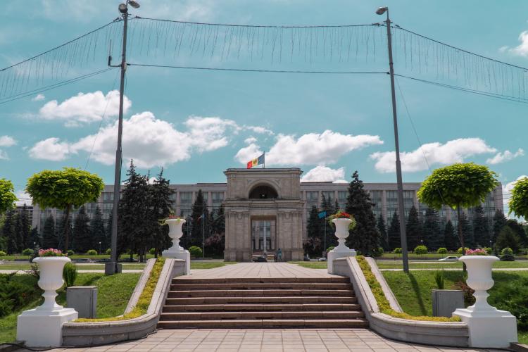 Stairs leading towards a building with a Moldovan flag