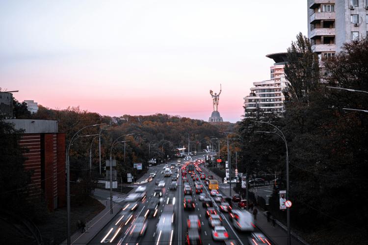 Photograph of a busy Kyiv road at sunset