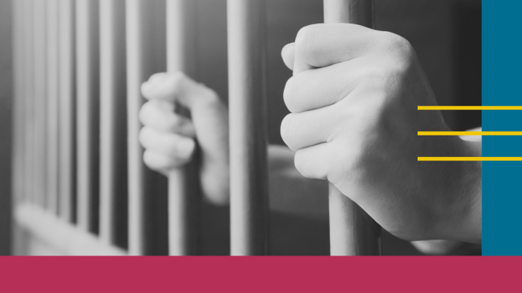 Hands behind bars