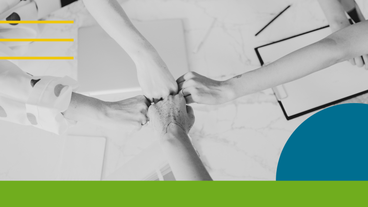 Four hands reaching to the center